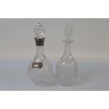 A contemporary silver collared cut glass decanter, of spherical form with small circular foot,