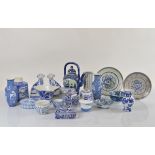 A collection of Chinese and Asian blue and white porcelain ceramics, including a pair of dogs,