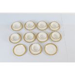 A collection of nine small French porcelain saucers and bowls, with Greek key borders, all of