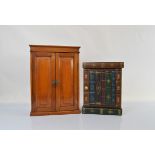 A mahogany hanging wall cabinet of rectangular form, with a pair of moulded panelled doors opening