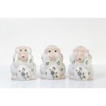 A set of three Chinese famille rose hear no evil, see no evil, speak no evil monkeys, with red