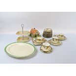 A Royal Doulton part Art Deco teaset, with heightened floral polychrome border and black rim