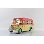 A painted wooden model of a Bedford Coach, in Whittaker's Tours West Midlands livery, with