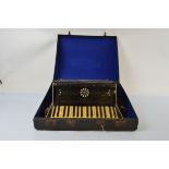 An Alvari accordion, with fretwork decoration, ivorine keys and buttons, leather straps, in case,