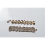 A continental early 20th Century white metal filigree bracelet, the rectangular panels with