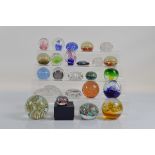 A collection of paperweights, including various millefiori, a novelty Beetle car example, a large