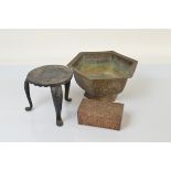 A Chinese brass hexagonal planter, on footed base with panel of mythical beasts and seal mark to