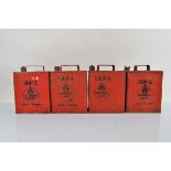 Four red painted petrol cannisters, impressed SM and BP Ltd