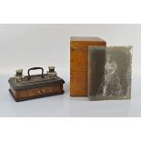 An early 20th century mahogany and ebonised desk stand, with two original glass inkwells (lids AF)