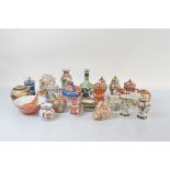 A collection of Chinese and Japanese polychrome decorated porcelain and pottery, including a matched