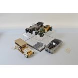 Four Franklin Mint vintage vehicle models, including 1955 Rolls Royce Silver Cloud I and 1911