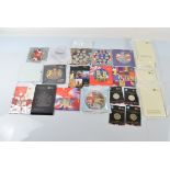 A collection of United Kingdom Brilliant Uncirculated Coin Collection from the 2000s, in card cases,