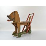 A 1930s/40s wooden "Ride-On" dog toy, 77cm long
