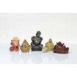 Six models all depicting the laughing/happy Buddha, in brass and resin in various poses, largest
