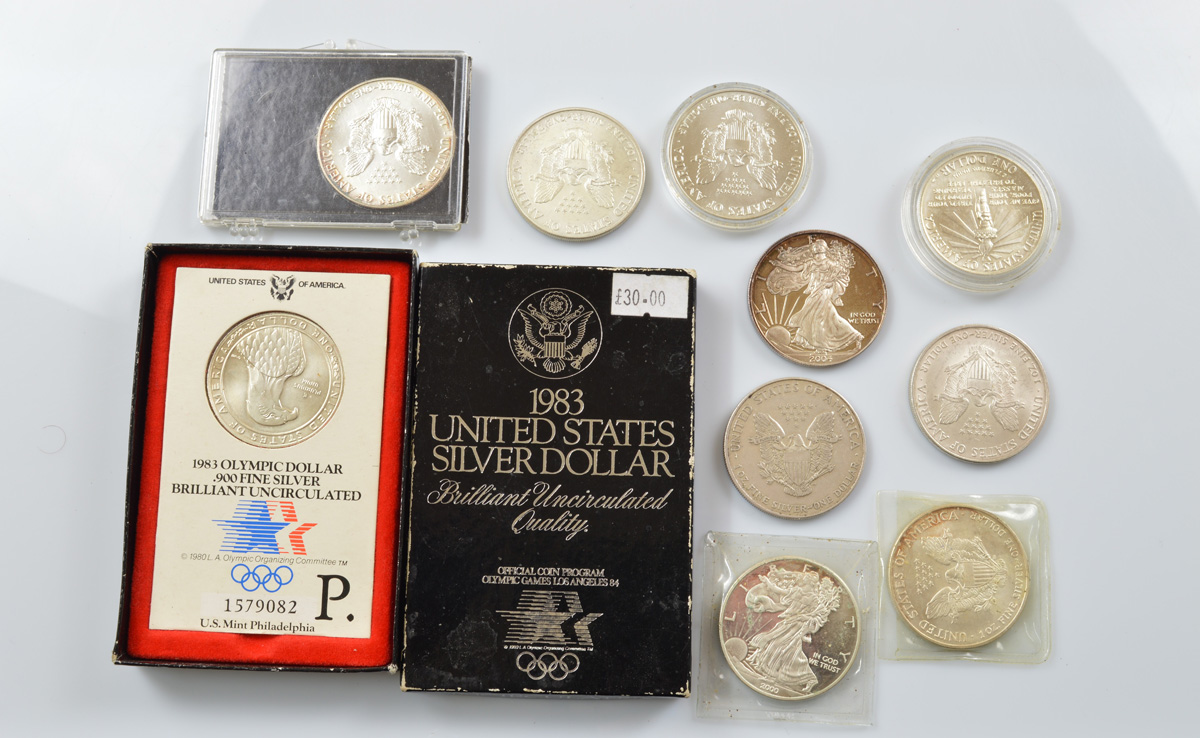 A collection of American contemporary silver dollars, including various commemorative examples for