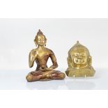 A brass model of a seated Thai Buddha, with lacquered and painted decoration, 33cm high together