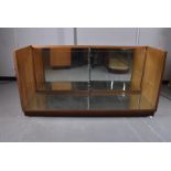 A large counter display, with mirrored sliding doors missing shelves, 182cm x 92cm x 60cm, AF