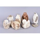 A extensive collection of shell decorated animal figures, including a penguin, a tortoise, birds,