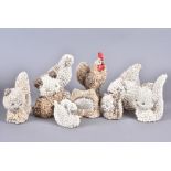 A large selection of novelty shell animal figures, the plaster figures decorated with miniature