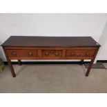 Oak sideboard, With three drawers to frieze, raised on square supports.