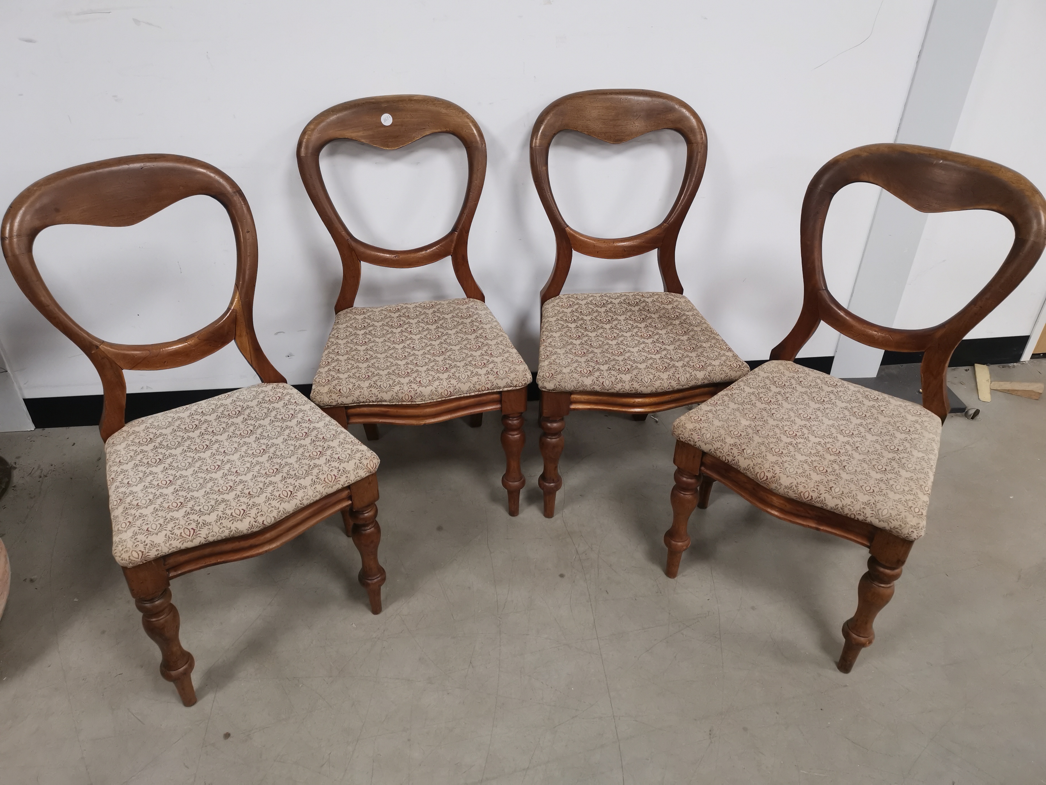 Set of four 19th Century balloon back chairs, raised on turned supports. One with obvious signs of