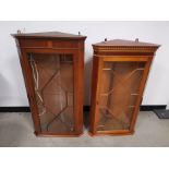 Two 20th Century glazed hanging corner cupboards, Both having internal glass shelves. (2)