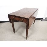 Mahgonay drop leaf table, Reed supports set on castors, drawer to one end, dummy drawer to the