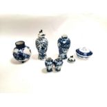 A group of predominantly Chinese blue and white ceramics, to include a covered jar with a continuous