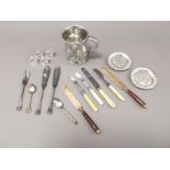 An assortment of silver plated ware, to also include a selection of candlesticks.