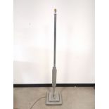 Art deco style floor standing lamp, having graduated stepped base. Height 158cm