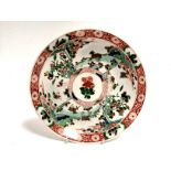 An 18th Century or later Chinese famille verte plate with overglaze enamel decoration, split into