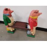 A novel occasional side table, of two pigs.