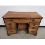 19th Century mahogany kneehole desk, one full length drawer to frieze, three drawers to either