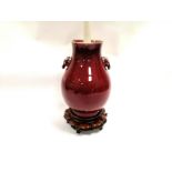 A 19th / 20th Century Chinese ox blood glaze flambe sang de boeuf vase twin deers head mounts, later