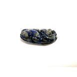 A Chinese lapis lazuli pebble, carved as mythical creature, length 8cm