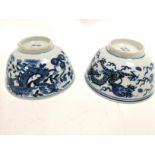 An associated pair of Chinese bowls with encircling dragons, one with flamming pearl and bat border,