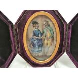 An encased oval original miniature painting of a courting couple, in Georgian dress although