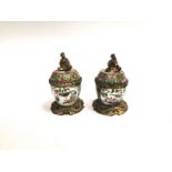 A pair of Chinese Canton export porcelain metal mounted sealed pots, with scrolling bases and