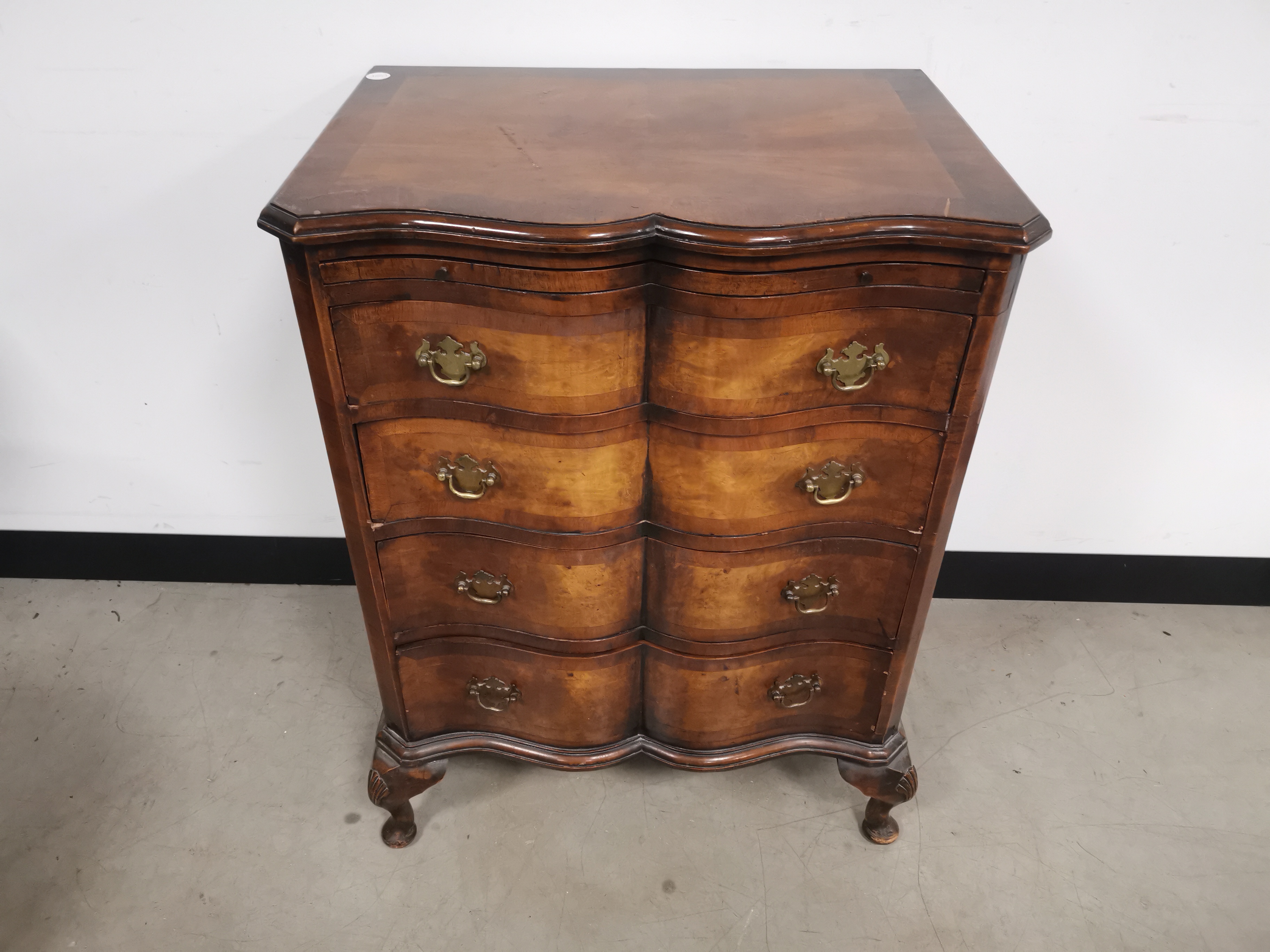 19th Century Walnut veneer serpentine set of drawers, four drawers with pull out shelf beneath the