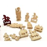 A group of Eastern bone carved chess pieces, in white and red, sixteen pieces in total, including