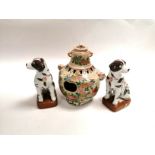 A Japanese Satsuma twin handled vessel with hand painted decoration of chrysanthemum flower heads,