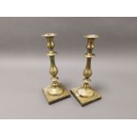 A pair of brass candlesticks