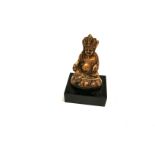 A miniature gilt cross legged figure, height 8.5cm