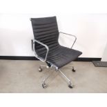 Mid 20th century designer desk chair, in the style of Eames, steel frame construction, black leather