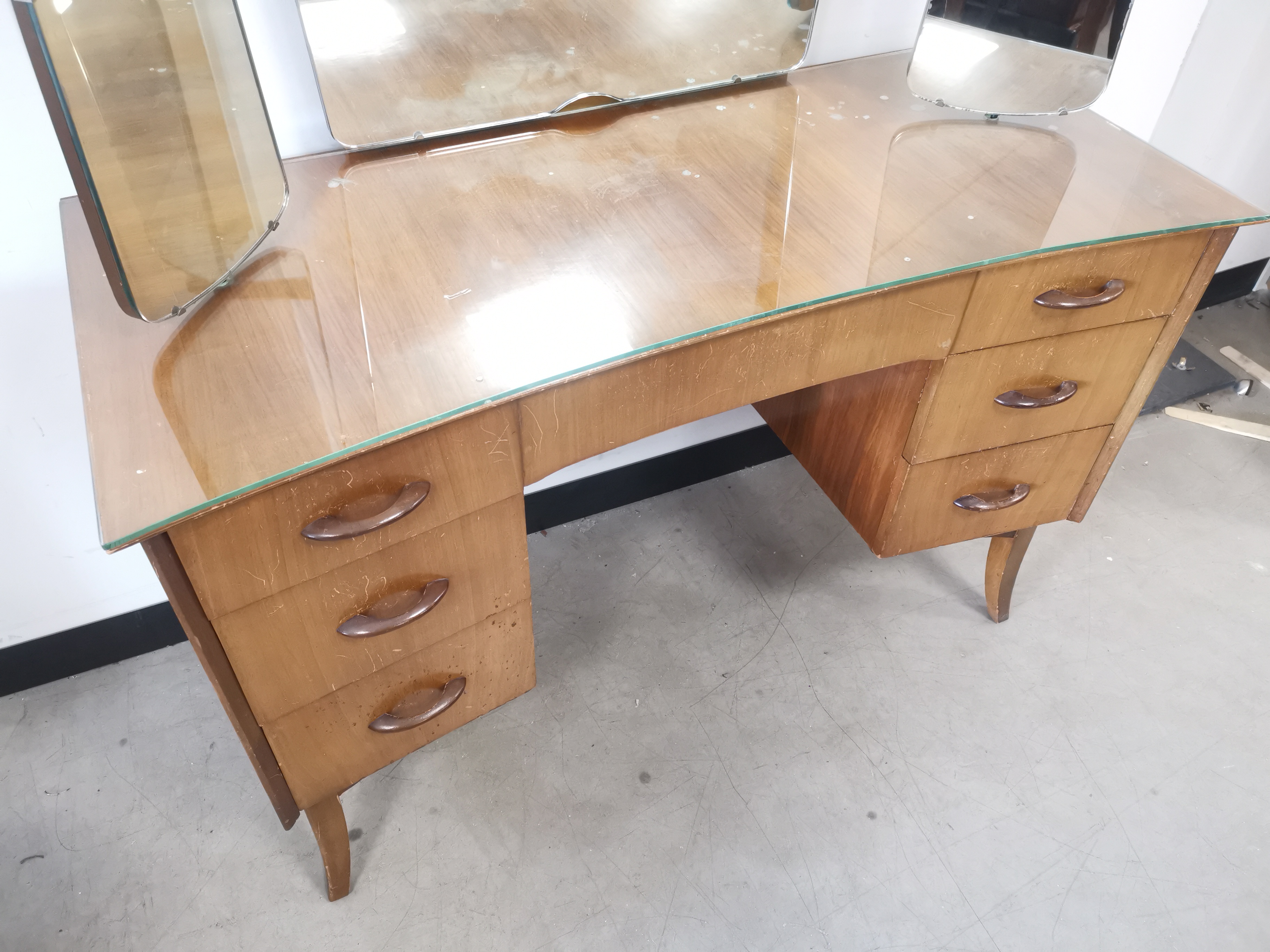 Mid 20th Century teak mirrored dressing table, having three adjustable mirrors, three drawers to