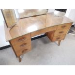 Mid 20th Century teak mirrored dressing table, having three adjustable mirrors, three drawers to