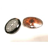 A faux tortoishell oval box mounted with a white metal or continental silver panel, 2.5cm x 7cm x
