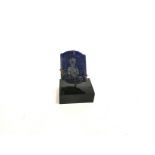 An Eastern lapis lazuli plaque with subject in prayer, after traditional Buddhist votive amulets,