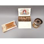 Two boxes containing 'Flor de Solaz' cigars, one open, the other partially sealed. Together with a