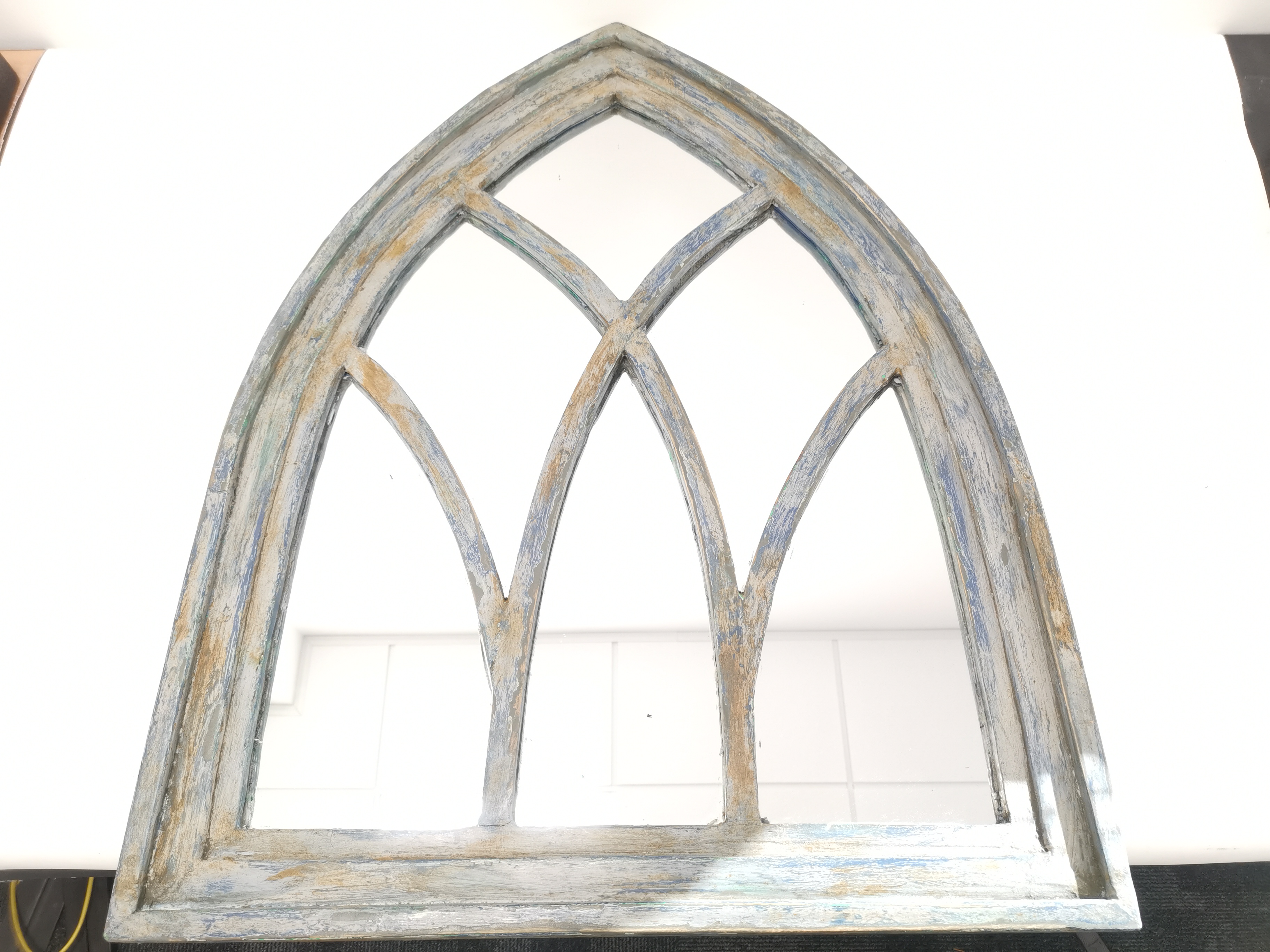 Painted arch framed mirror, having distressed finish to framework. 81cm x 66cm